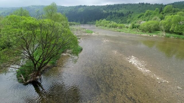 Spring picturesque mountain river band view. (Stryi river near Skhidnytsya village, Carpathians, Ukraine.)
