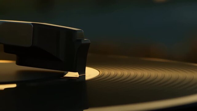 Close-up of turntable needle resting on spinning vinyl record
