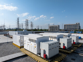 Fototapeta premium Power substation energy storage equipment and transmission towers landscape