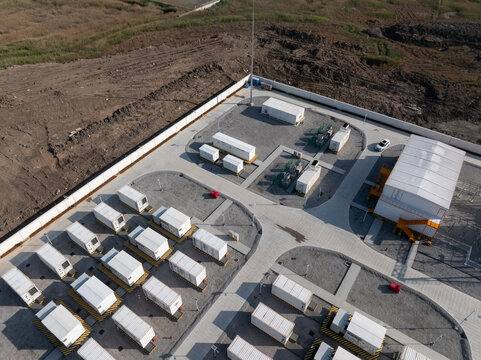 aerial view of energy storage power station with container battery equipment and industrial facilities
