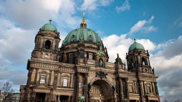 Hyperlapse of Berlin Cathedral with dramatic white clouds and blue sky. Closeup angle and truck movement