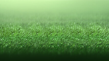 Fototapeta premium Close-up of vibrant green grass blades under soft light, fading into a blurry background. Ideal for nature, sports, and eco-friendly themes