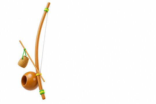 Brazilian berimbau musical instrument set with gourd and caxixi, isolated on a white background. Perfect for capoeira.