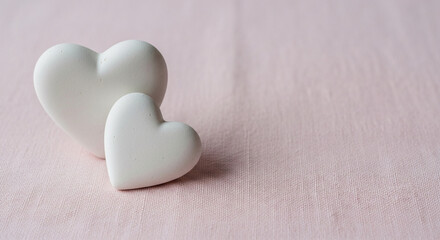 Obraz premium Delightful white hearts on soft pink background