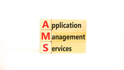 Naklejka premium AMS application management services symbol. Concept words AMS application management services on beautiful wooden blocks. Beautiful white background. Business AMS concept. Copy space.