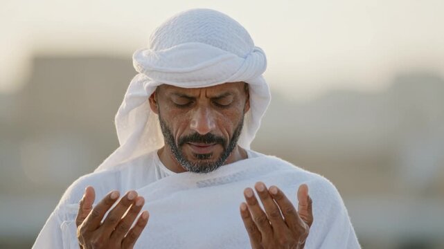 Emotional Day of Arafah pilgrim praying through tears in golden light for heartfelt Islamic faith documentary moments