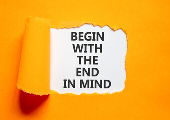 Begin with the end in mind symbol. Concept words Begin with the end in mind on beautiful white paper. Beautiful orange paper background. Business begin with the end in mind concept. Copy space. © Dzmitry