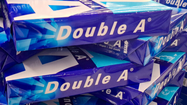 Stack of Double A brand premium copier paper reams for office document printing and school stationery supply on May 21, 2026 in Bangkok, Thailand