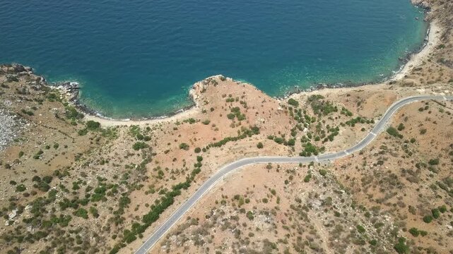 The coastal road in Mui Doi Moi, Ca Na bay, Binh Thuan seen from above with the boulevard and railway, the coast close together is considered a beautiful bay in central Vietnam.