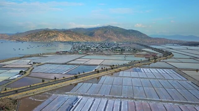 Aerial Drone Footage Ca Na Coastal Salt Fields Geometric White Salt Pans Workers Harvesting Ninh Thuan Vietnam