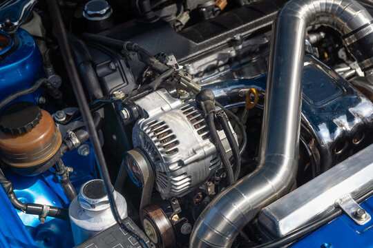Close-up of Alternator in a Transverse Front-Wheel-Drive Gas Engine Bay