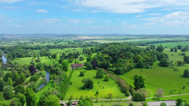 Aerial shot flying over the market town of Wilton towards Wilton House.. Wiltshire, UK