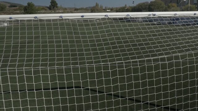 Football soccer field ground pitch stadium goal net crane jib down backwards