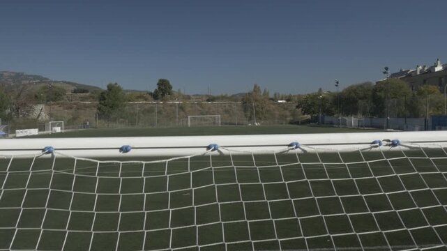 Football soccer field ground pitch stadium goal net crane jib traveling down 2