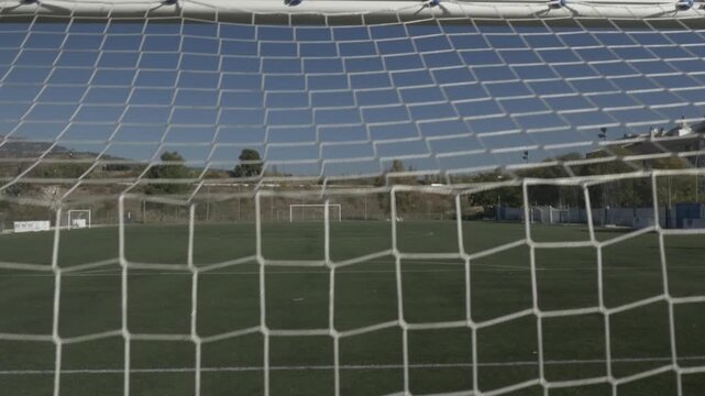 Football soccer field ground pitch stadium goal net crane jib traveling down 4