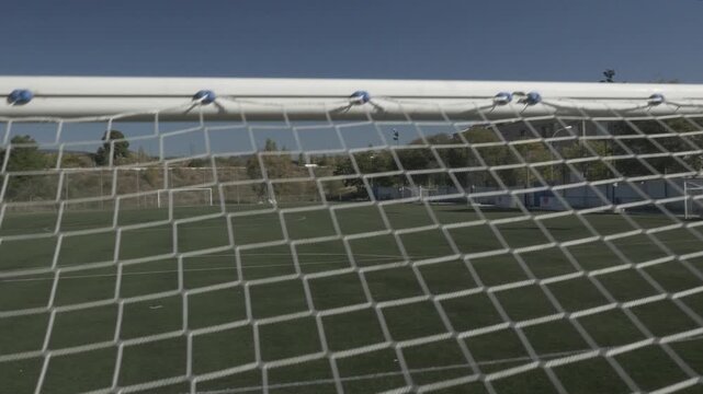 Net goal football soccer field ground pitch stadium crane jib traveling up right