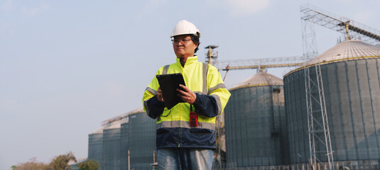 Fototapeta premium Technicians are inspecting the operational systems of the fresh food processing plant structure.