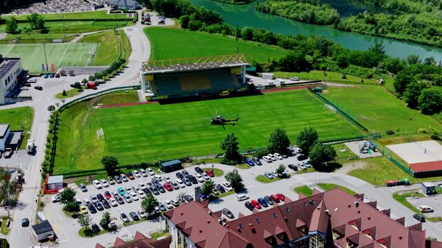 Medical rescue helicopter landed on sports field aerial view