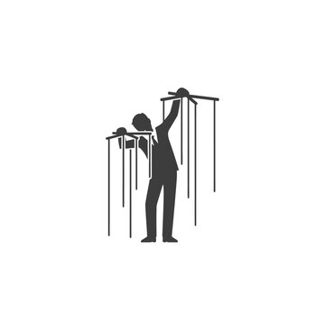 a man controlling puppets on strings.