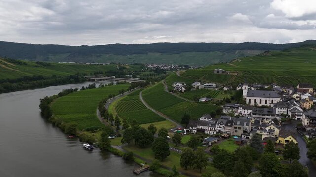 Aerial view of river meander past german village with vineyards