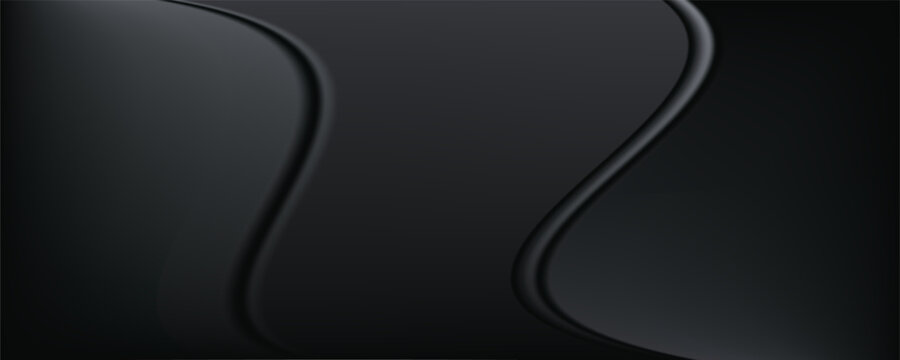 Sandblasted or brushed titanium or steel metal surface, the light reflection of the curved lines creates a smooth gradation on the dark black metallic background