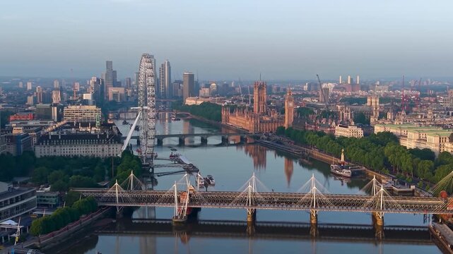 Panoramic aerial view of the skyline of London, England, with Southbank and Embankment, Westminster Palace back to Nine Elms during summer sunrise