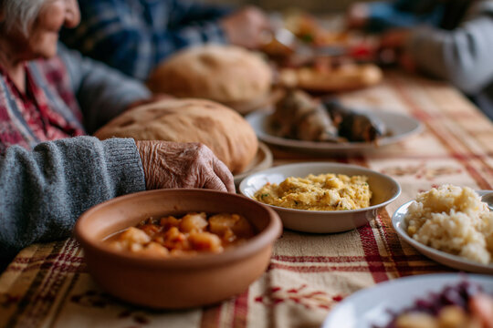 Warm hands reach for food beside others. Familiar dishes fill a shared table. Caring moments linger in the quiet. Simple meals, shared, comforted, nourished. Perfect for family gatherings