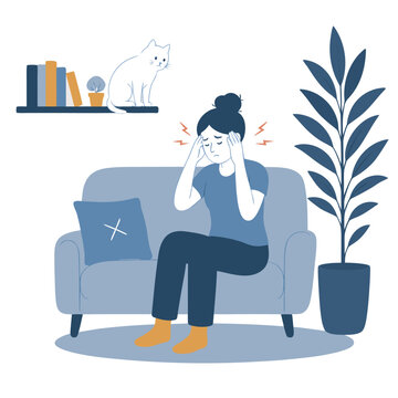 Woman with severe headache or migraine sitting on couch