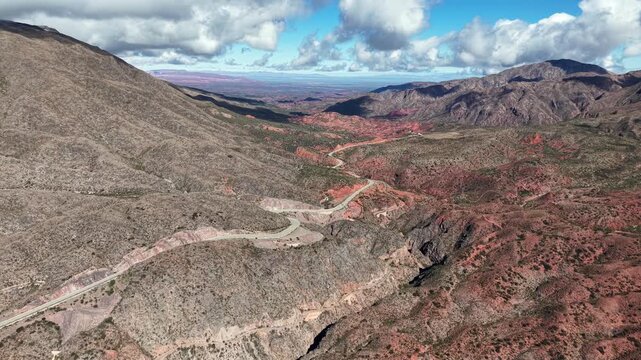 Aerial drone view of the winding road through Cuesta de Miranda canyon on Ruta 40, La Rioja, Argentina.