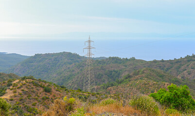 Obraz premium High voltage transmission towers and electrical substation at sunset