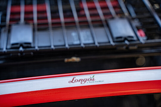 Close up of Longo's shopping cart inside grocery store. Markham, Canada - May 30, 2026.