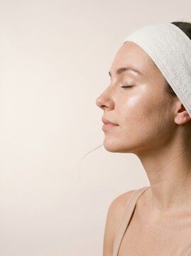 woman profile with white headband skincare routine wellness-routine