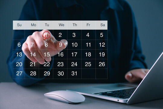 Digital calendar scheduling concept with hand selecting date on virtual interface, time management, appointment planning, business organization, deadline tracking, and productivity workflow system.