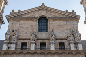 Fototapeta premium San Lorenzo de El Escorial, Spain. Six statues of Kings of Judah by Juan Bautista Monegro on the basilica facade, with Latin inscriptions below each figure. Built 1563-1584