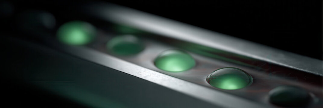 Glowing green cell sample on microscope slide laboratory science biotechnology research closeup futuristic sterile innovation medical analysis experimental