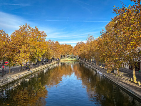 Long autumn perspective of canal Saint Martin in Paris, France