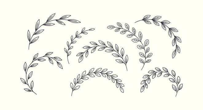 Set of hand-drawn elegant leaf branches and floral laurel wreaths for wedding invitation design.