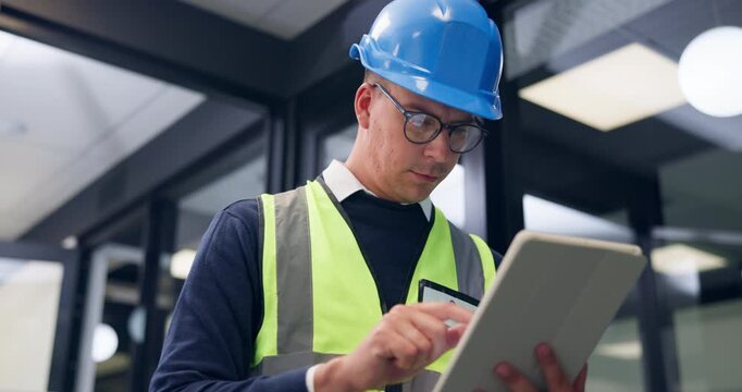 Construction, engineer and man on tablet in office for inspection, renovation idea and report. Architecture, scroll and person on tech for compliance, building assessment and property evaluation