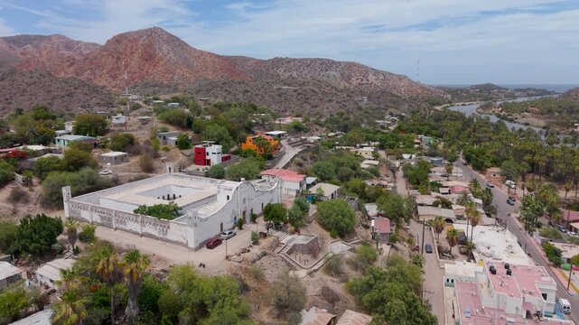 Watch aerial views of the historic Mulege jail and surrounding town in Baja California Sur, Mexico. Discover the scenery and landmarks.