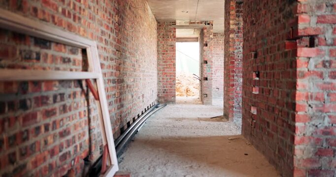 Construction, hallway and brick wall with interior of building for renovation, architecture and concrete. Property development, industrial and empty space or site for real estate and home restoration