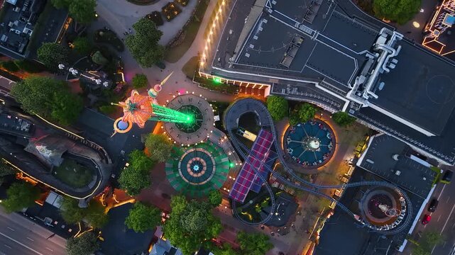 Top-down aerial view of amusement park after dark