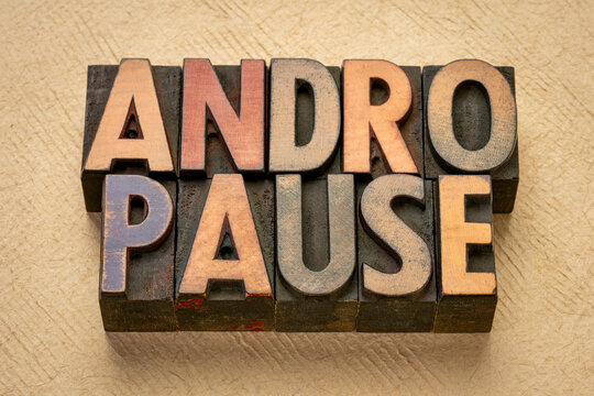 andropause - male menopause - abstract n vintage wood letterpress printing blocks against art paper