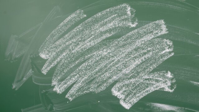 Chalk rubbed out on green chalkboard background