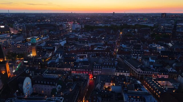 Flight over Copenhagen city center after sunset