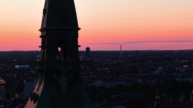 Drone shot of City Hall Tower at dusk in Copenhagen, Denmark