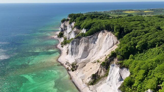 Drone shot of Mons Klint white chalk cliffs and Baltic Sea coastline in Denmark