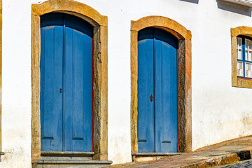 Fototapeta premium Old doors with arches and stone frames, typical of the colonial architecture of the city of Ouro Preto.