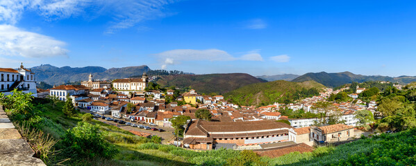 Fototapeta premium Panoramic view of the city of Ouro Preto through the typical hills of Minas Gerais.