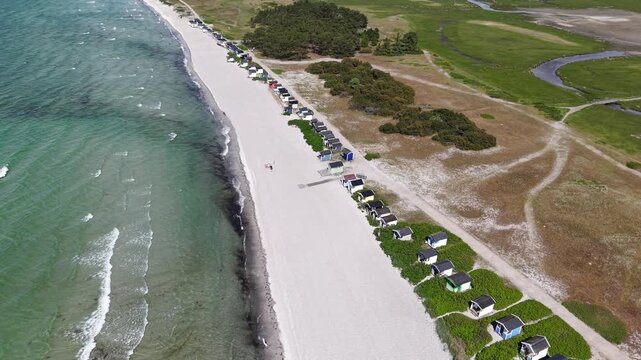 Aerial view of Skanor beach with colorful wooden huts at Baltic Sea in Sweden