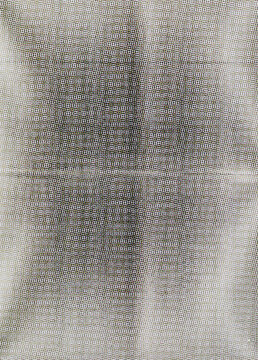 macro view of a CMYK halftone rosette pattern printed on matte photo paper.